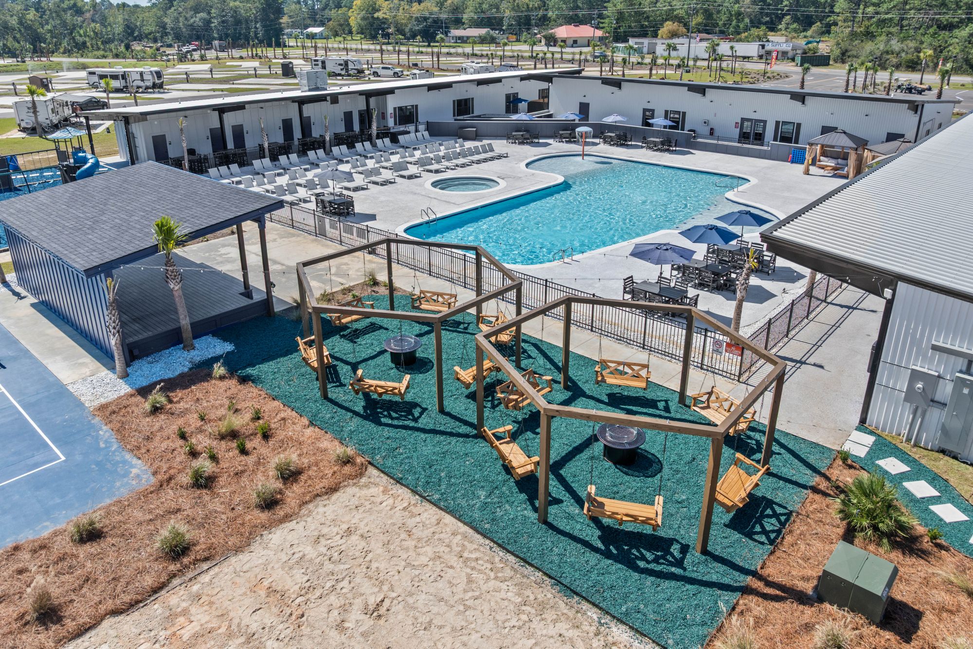 Resort pool, bandstand, and swing chairs