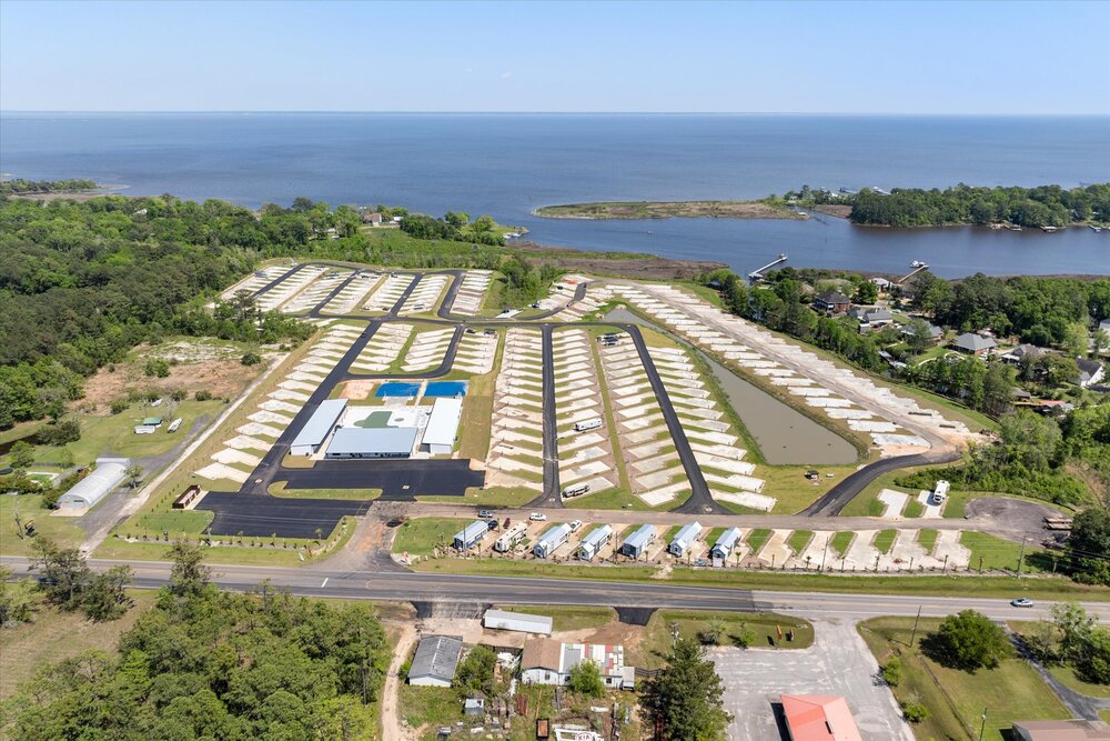 Aerial view of Paradise Found RV Resort and waterfront